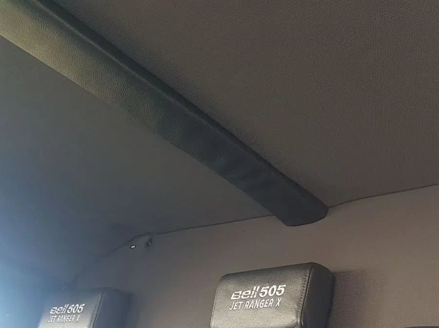 Passenger safety head pads for Bell 505 helicopter